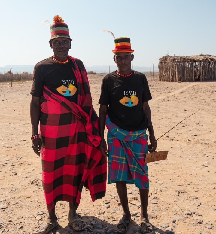 Two elders wearing ISVD t-shirts