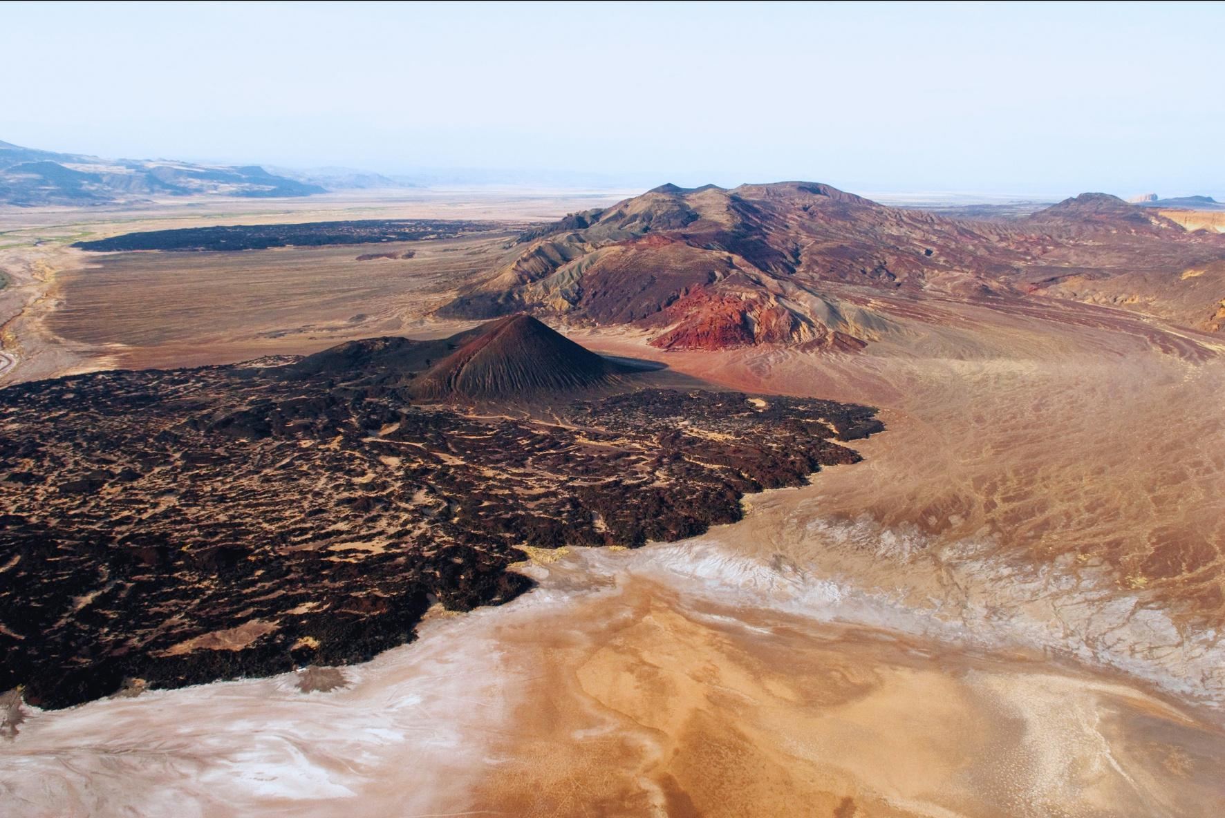 Aerial view of lava fields and the salt flats of the Suguta Valley